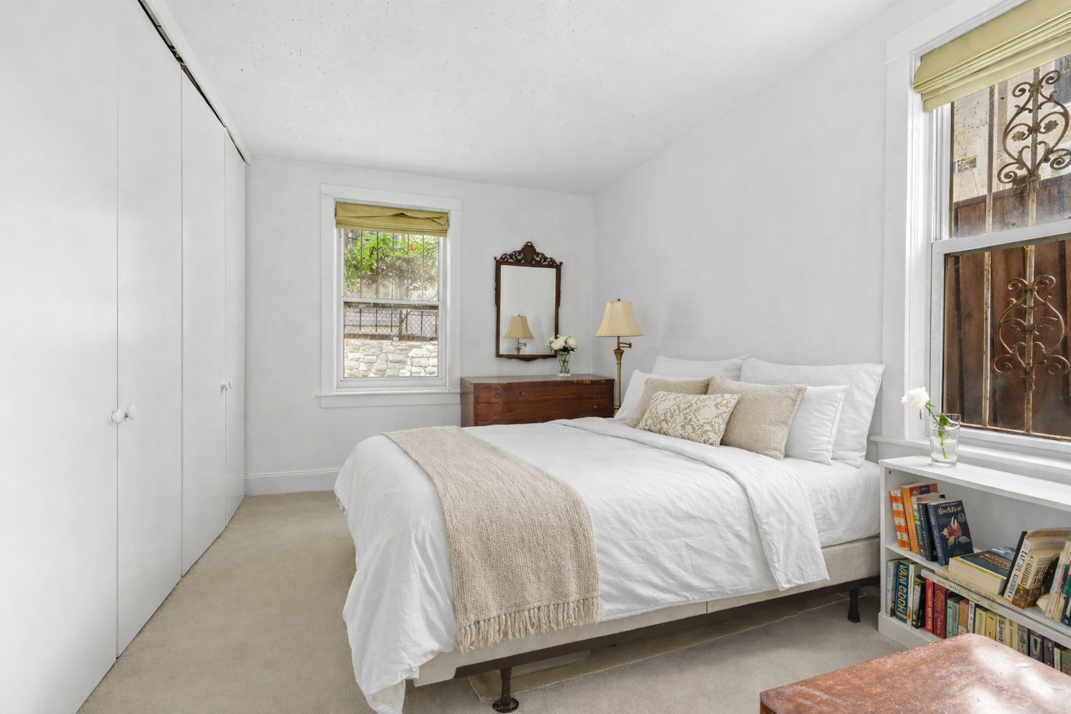 50 East 83rd Street, Unit 1R Manhattan, NY 10028 - Photo 8 of 12 a bedroom with a bed and window