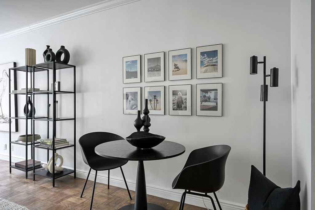 300 East 74th Street, Unit 6D Manhattan, NY 10021 - Photo 7 of 12 a table and chairs in a room with a window