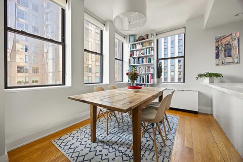 a dining room with a table and chairs