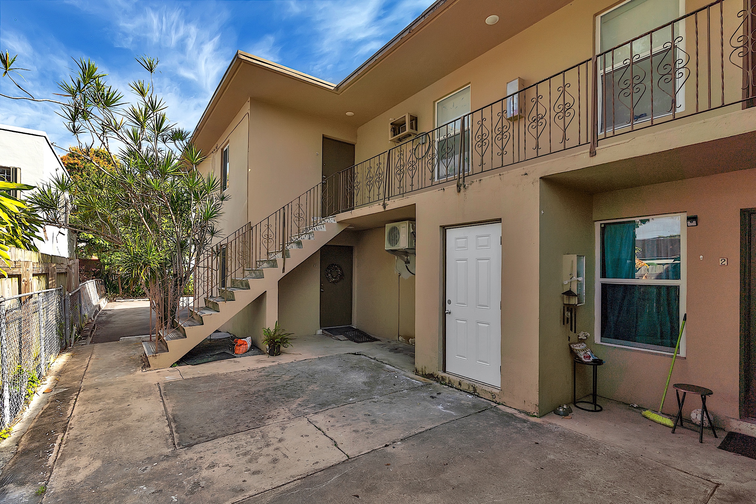 1361 Southwest 4th Street Miami, FL 33135 - Photo 15 of 23 a view of a house with wooden stairs and a table