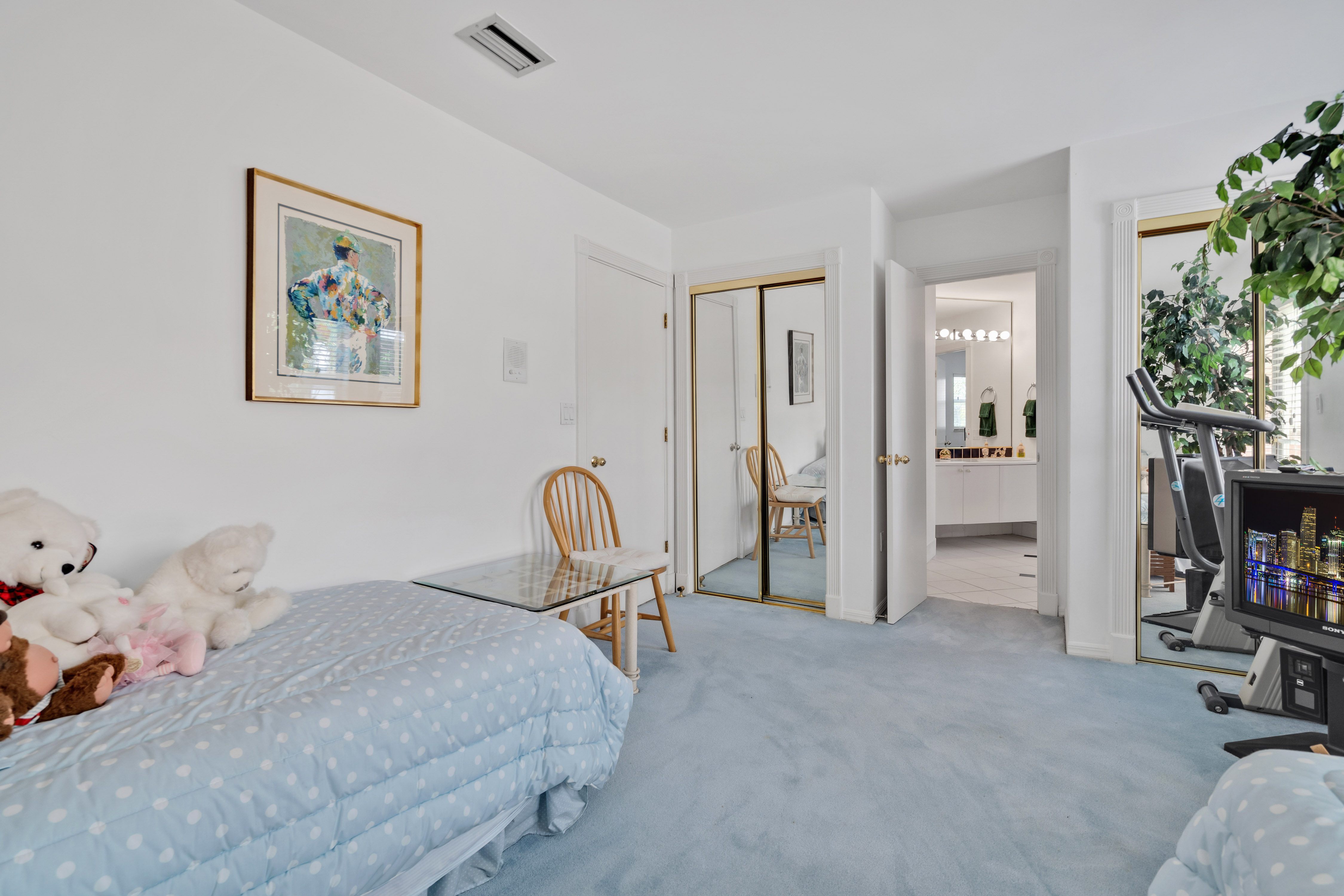 8768 Southwest 62nd Court Miami, FL 33156 - Photo 37 of 56 a bedroom with a bed and a chandelier