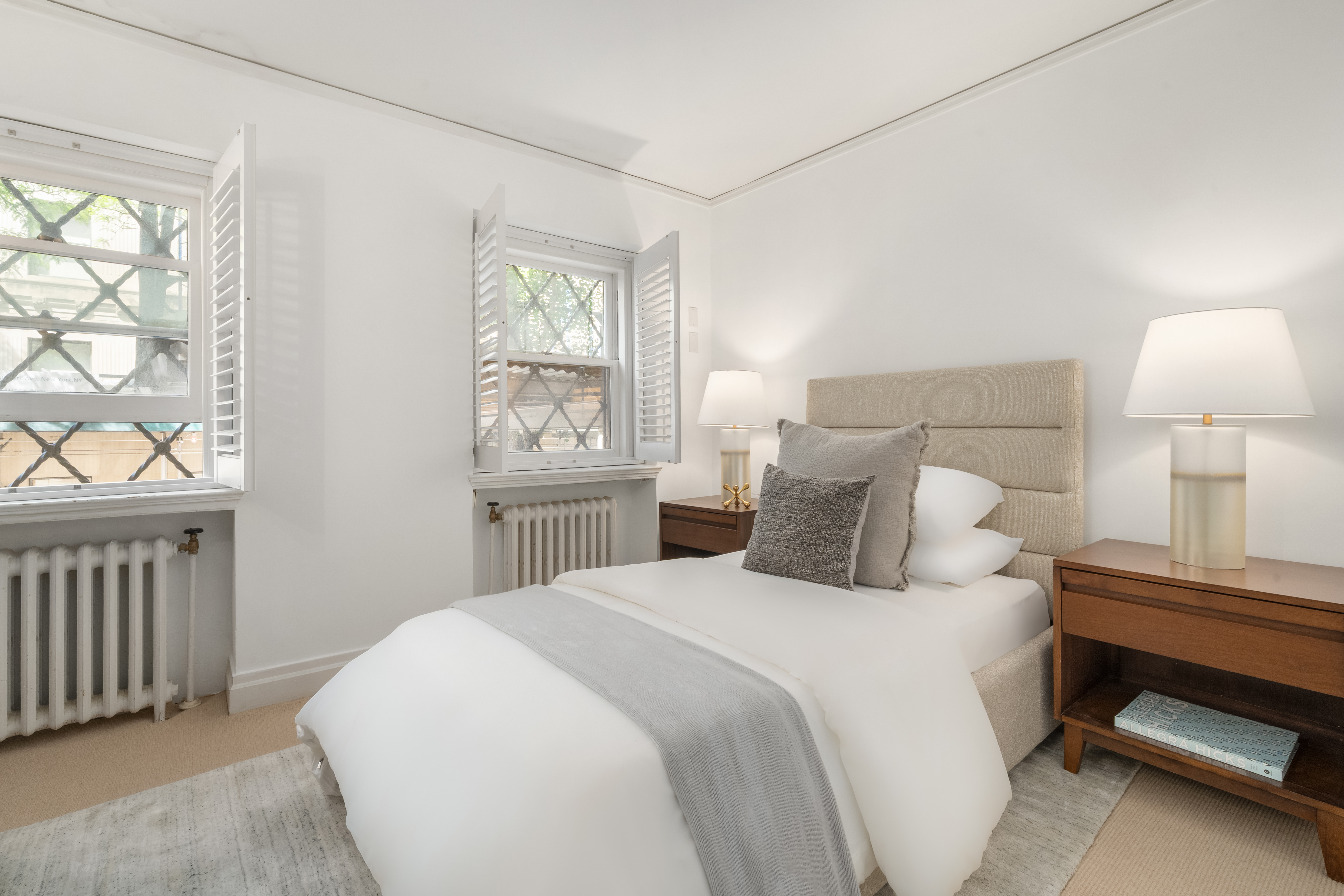 46 East 71st Street Manhattan, NY 10021 - Photo 22 of 27 a bedroom with a bed and a window