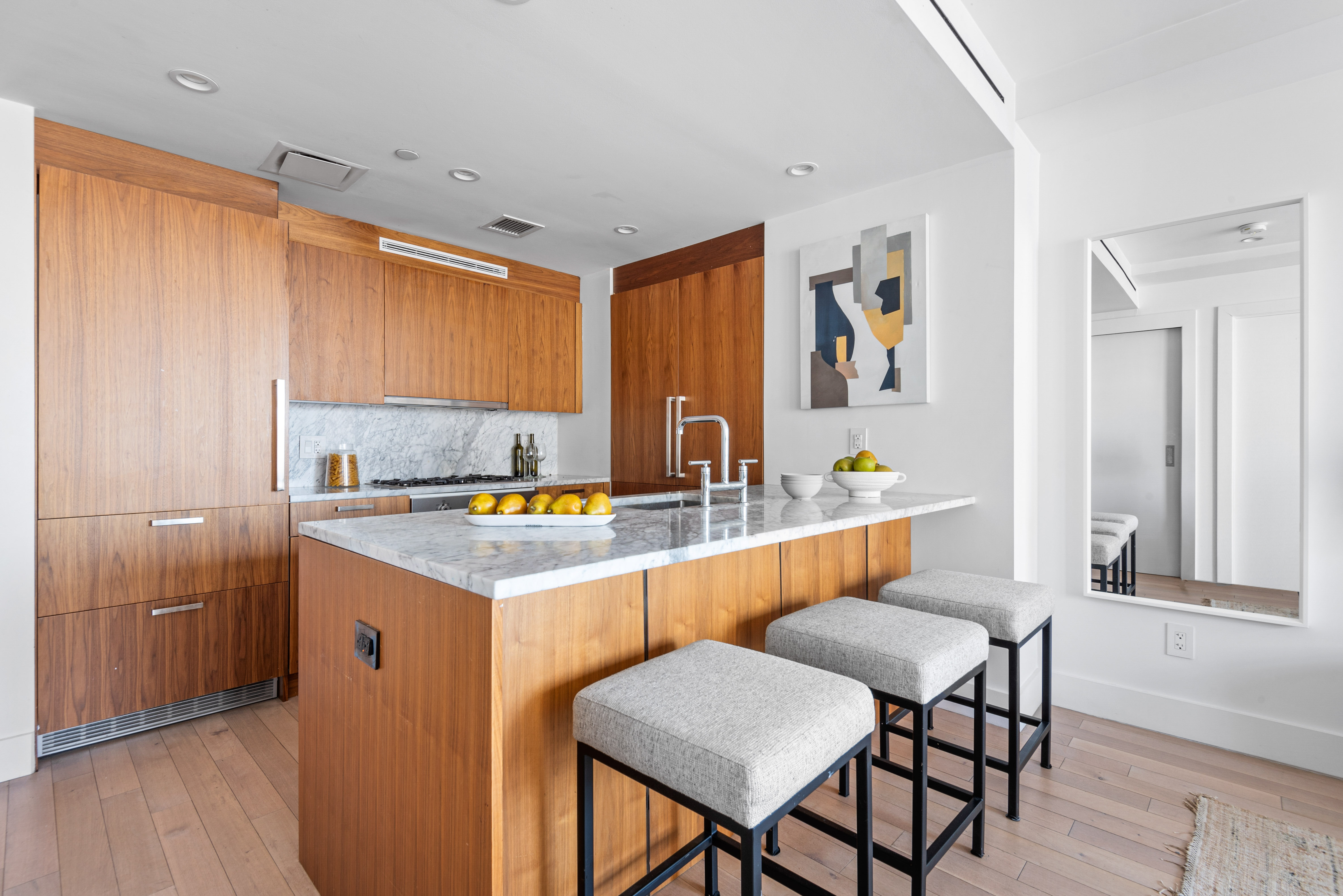 476 Union Avenue, Unit PH5A Brooklyn, NY 11211 - Photo 5 of 17 a kitchen with a sink and chairs