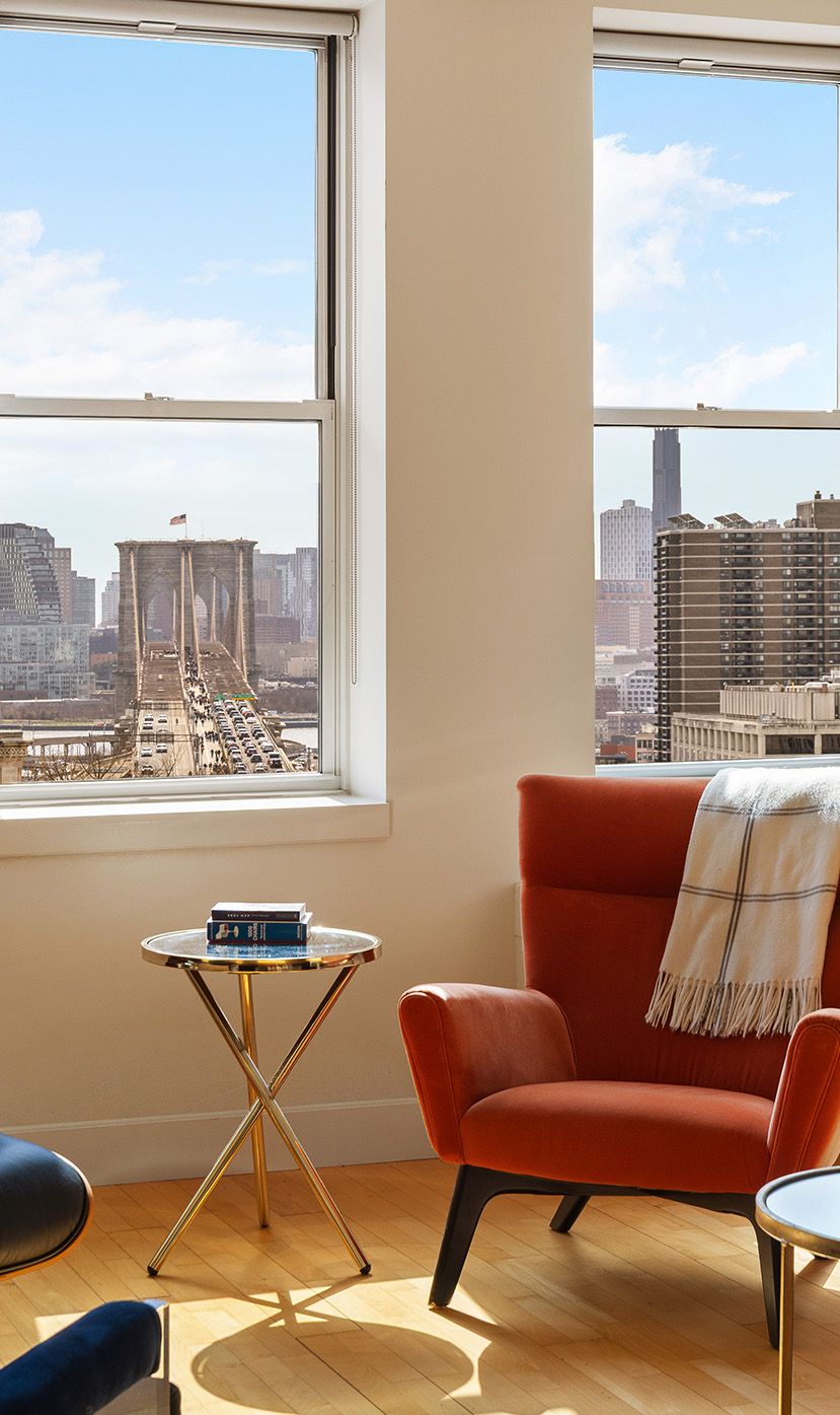 80 Chambers Street, Unit 11A Manhattan, NY 10007 - Photo 4 of 24 a living room with furniture and a large window