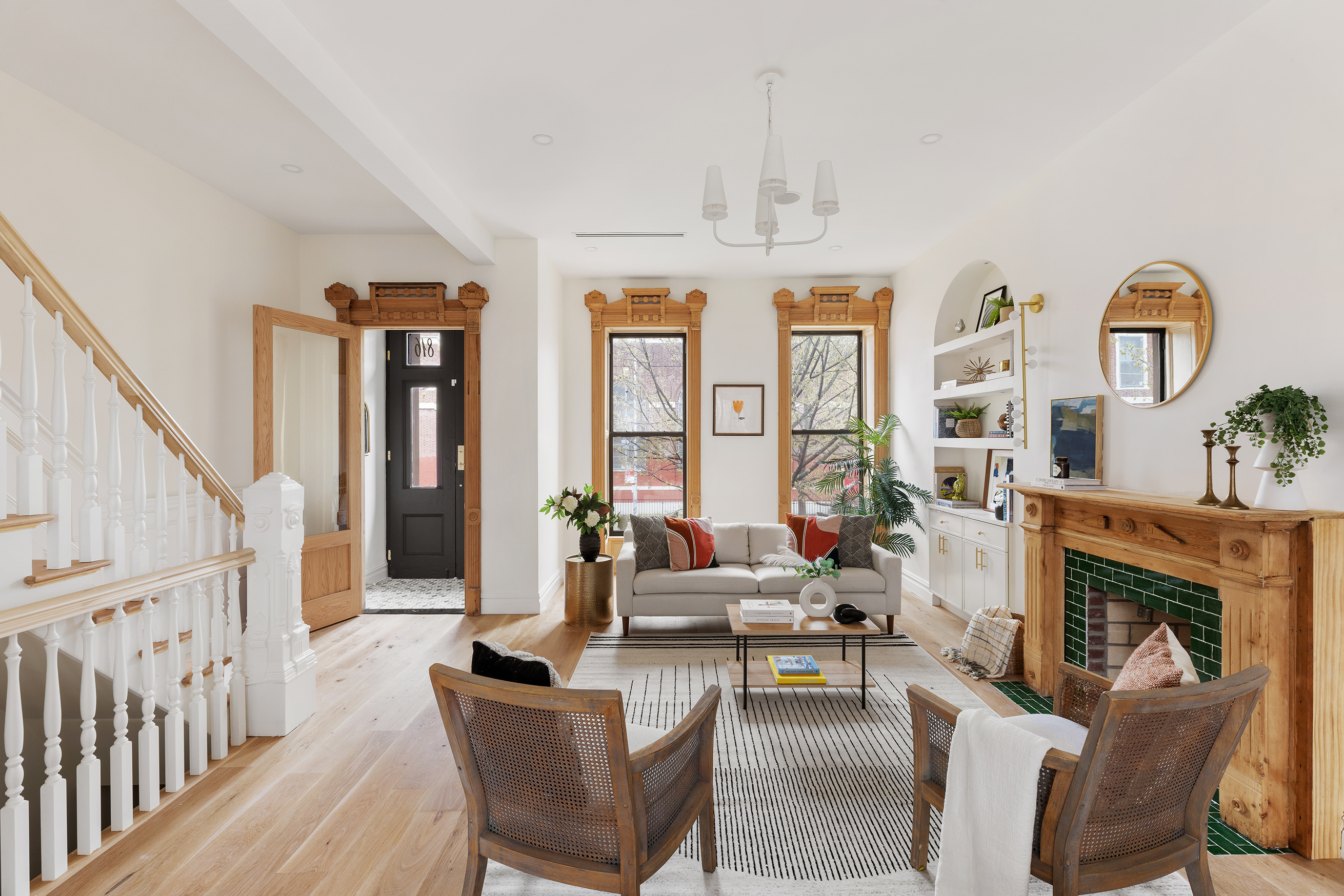 816 Lafayette Avenue, Unit MF Brooklyn, NY 11221 - Photo 2 of 22 a living room with furniture a fireplace and a chandelier