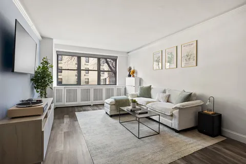 a living room with furniture and a window