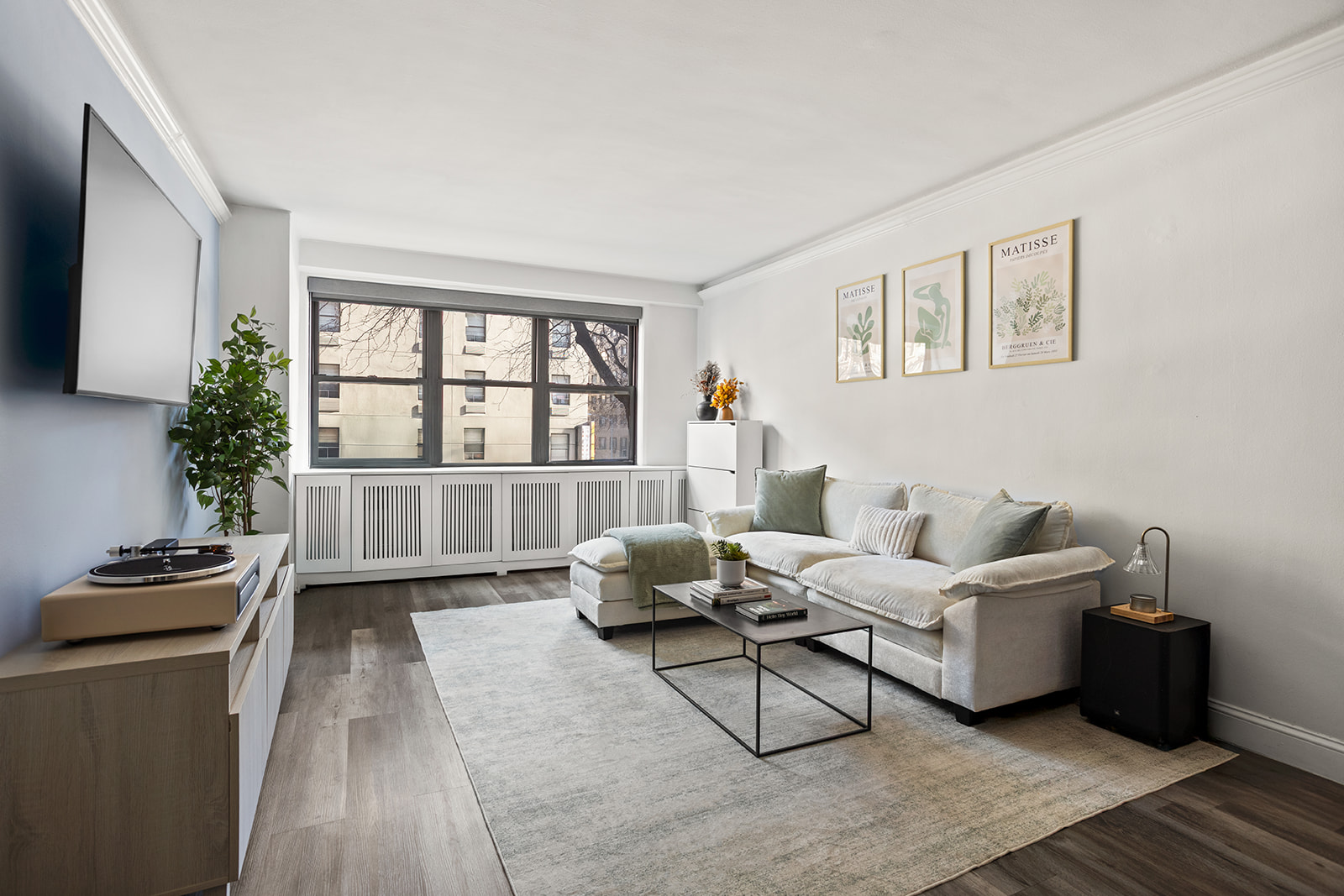 330 3rd Avenue, Unit 3F Manhattan, NY 10010 - Photo 2 of 6 a living room with furniture and a window