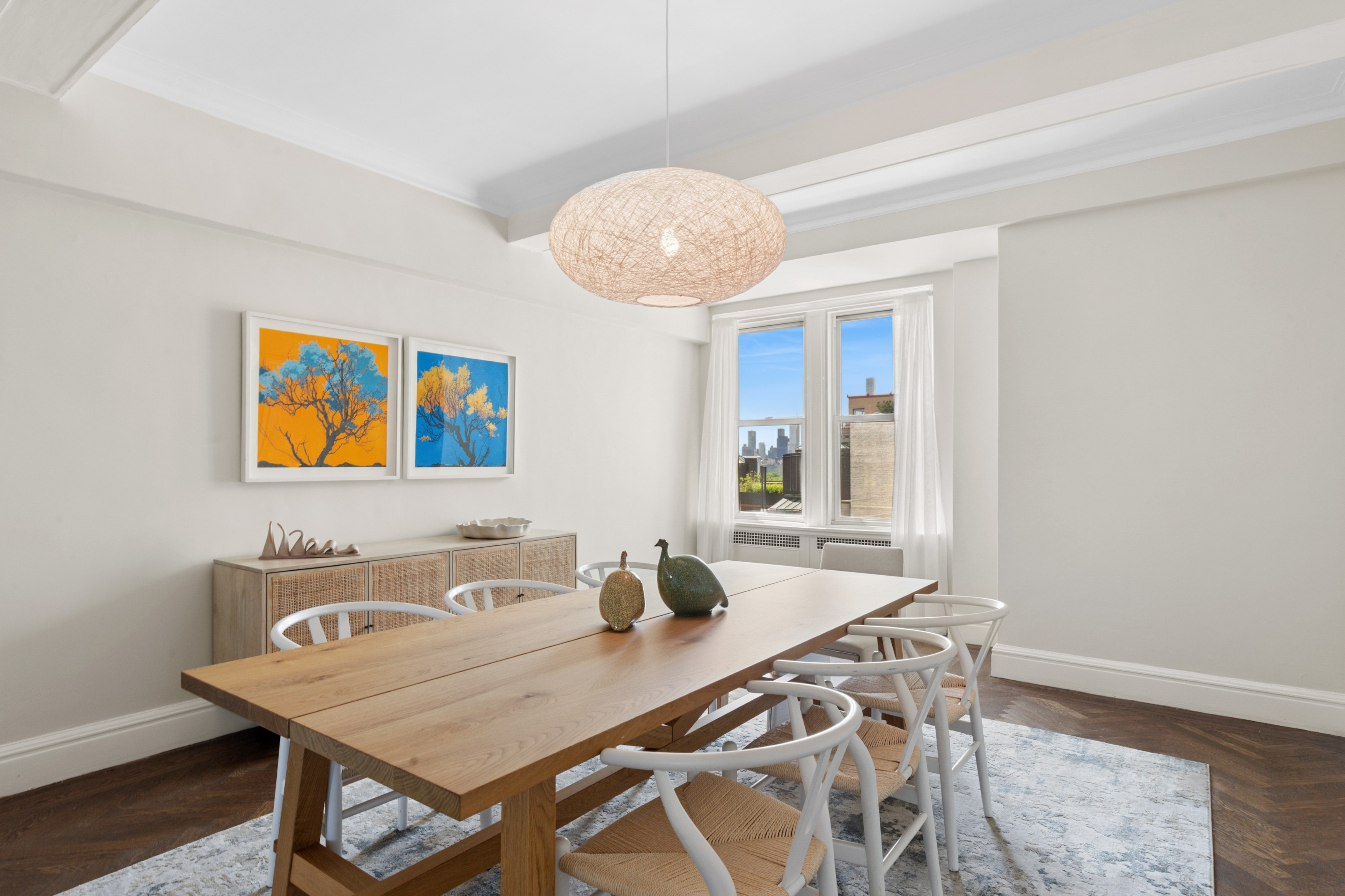 336 Central Park West, Unit 16F Manhattan, NY 10025 - Photo 5 of 18 a view of a dining room with furniture and wooden floor