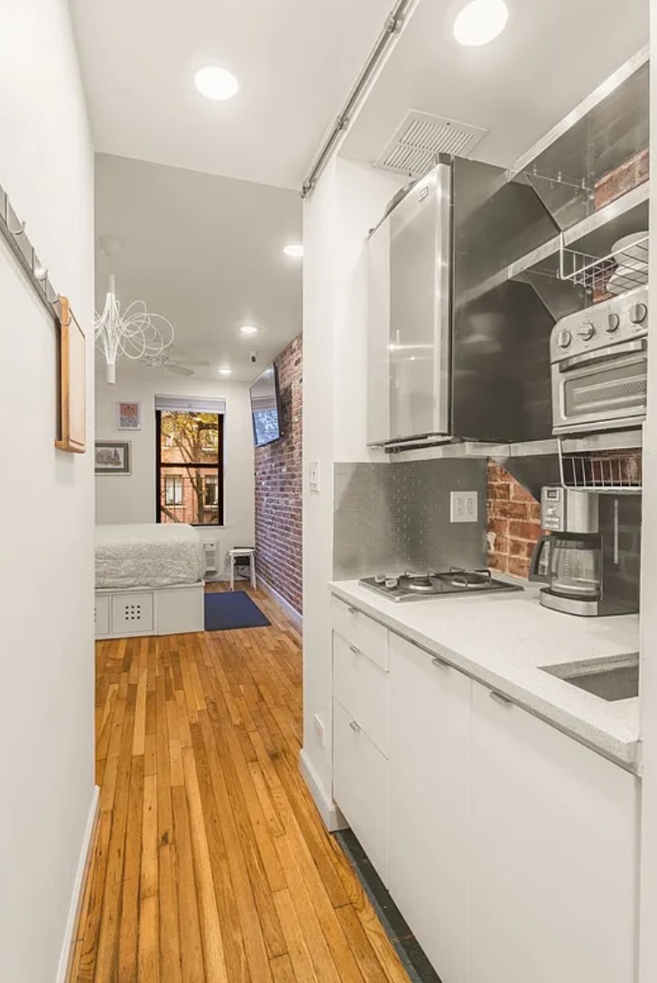 430 East 87th Street, Unit 2A Manhattan, NY 10128 - Photo 6 of 8 a spacious bathroom with a sink and a mirror
