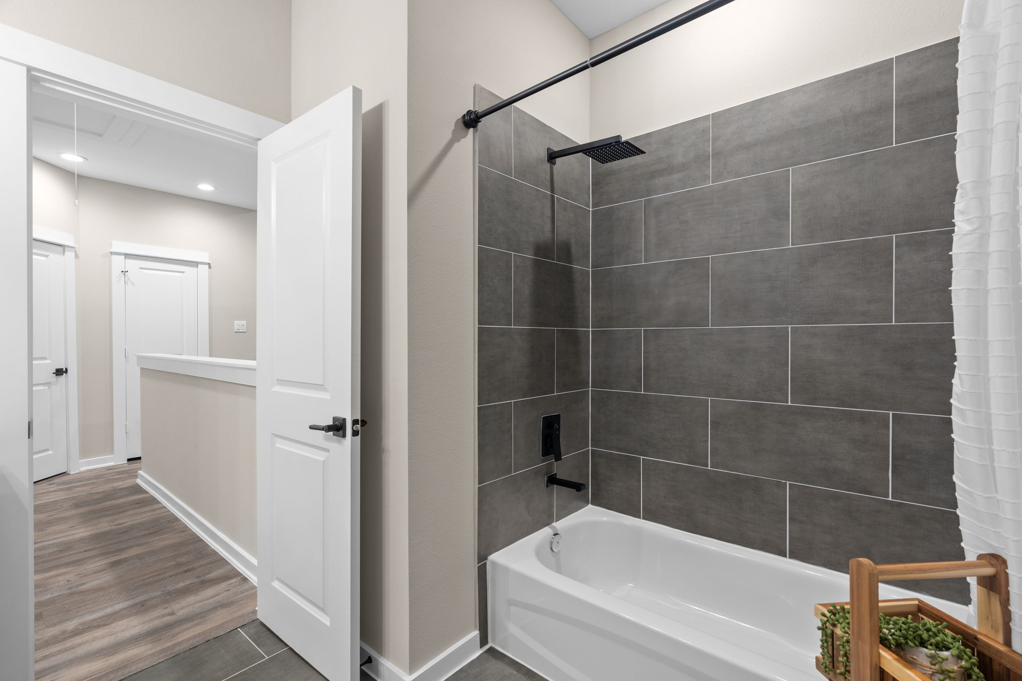 11303 Stonework Grv Lane Houston, TX 77076 - Photo 32 of 39 a bathroom with a bathtub and a shower