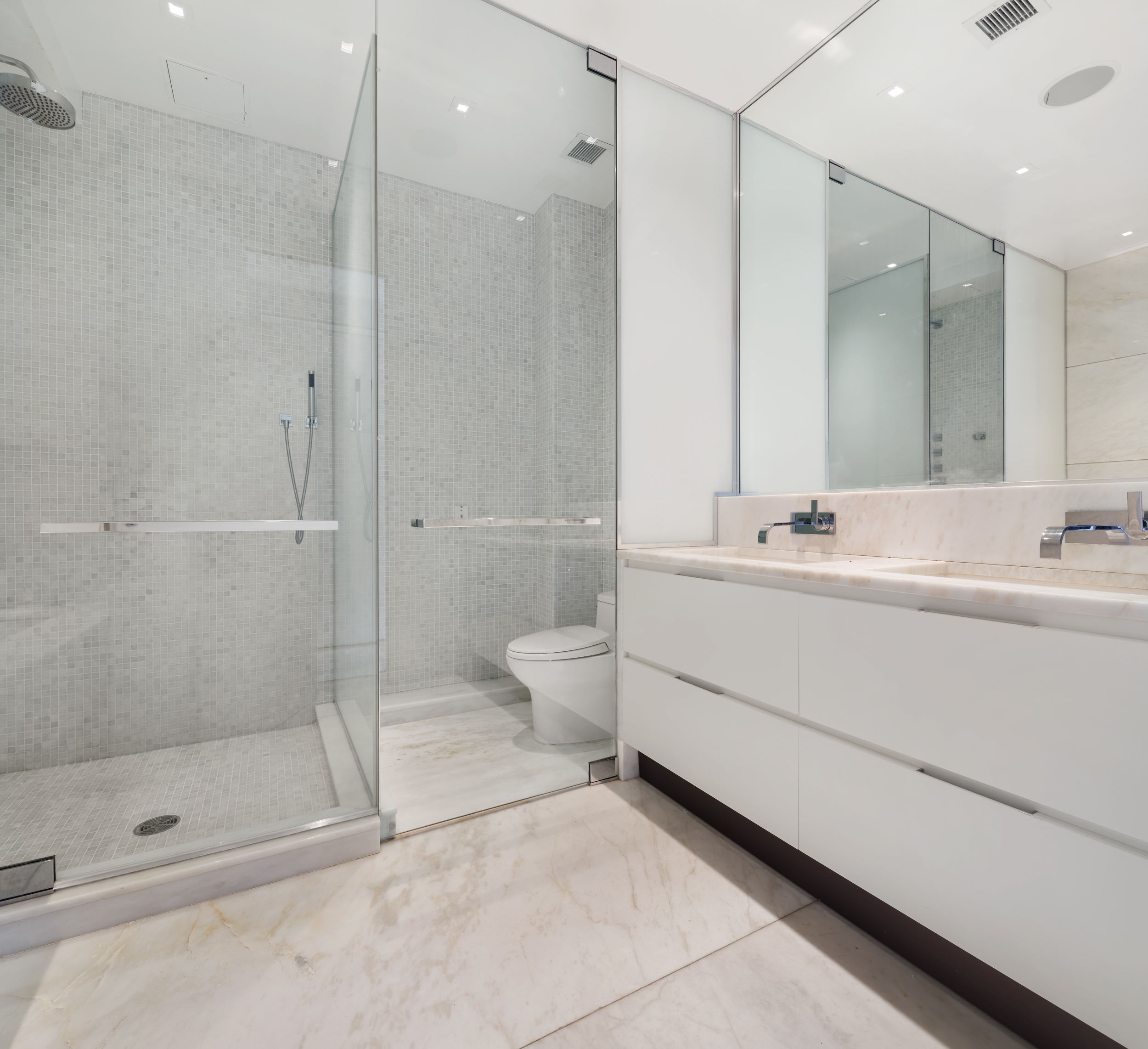 1055 Park Avenue, Unit PH Manhattan, NY 10028 - Photo 13 of 19 a bathroom with a shower sink and toilet