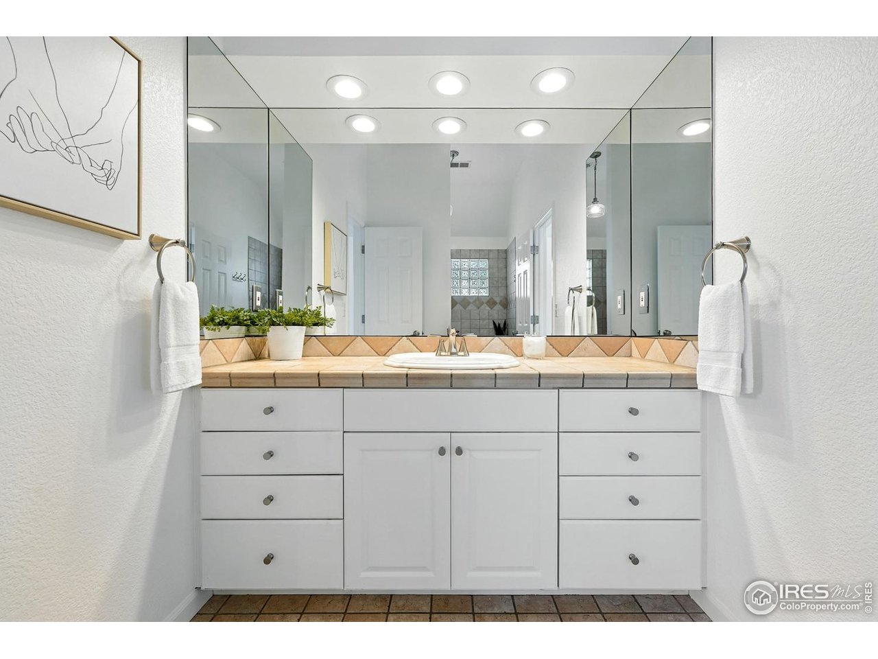 4557 Apple Way Boulder, CO 80301 - Photo 40 of 50 a bathroom with a sink vanity granite and a mirror