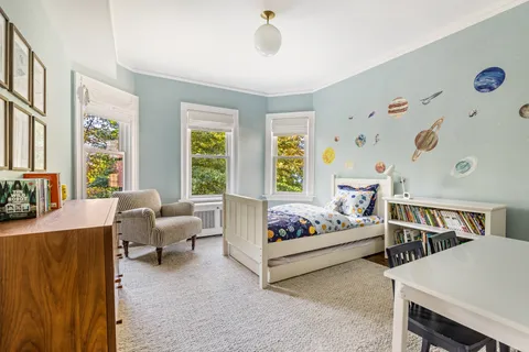a bathroom with a tub a sink and a mirror