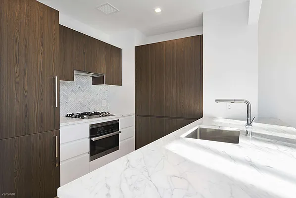 100 Avenue A, Unit 4E Manhattan, NY 10009 - Photo 2 of 5 a bedroom with a bed and a dresser