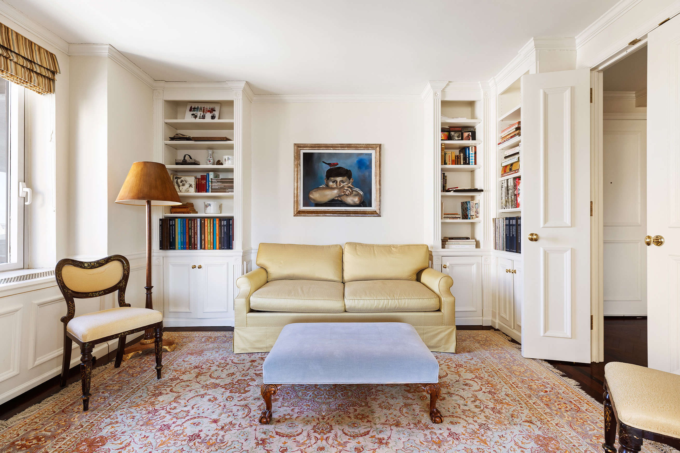1049 5th Avenue, Unit 17A Manhattan, NY 10028 - Photo 5 of 11 a living room with furniture and a rug