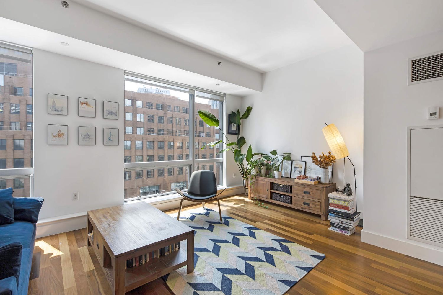 150 Myrtle Avenue, Unit 805 Brooklyn, NY 11201 - Photo 3 of 26 a living room with furniture and a floor to ceiling window
