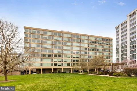 a view of a large building with a yard