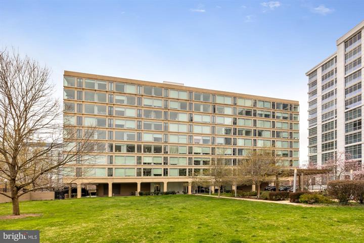 a view of a large building with a yard