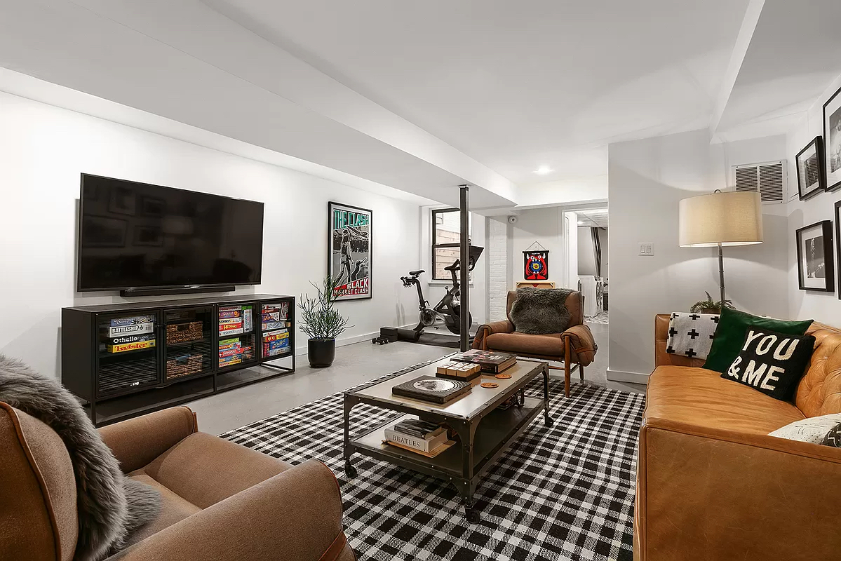 207 Windsor Place Brooklyn, NY 11215 - Photo 16 of 20 a living room with furniture and a flat screen tv