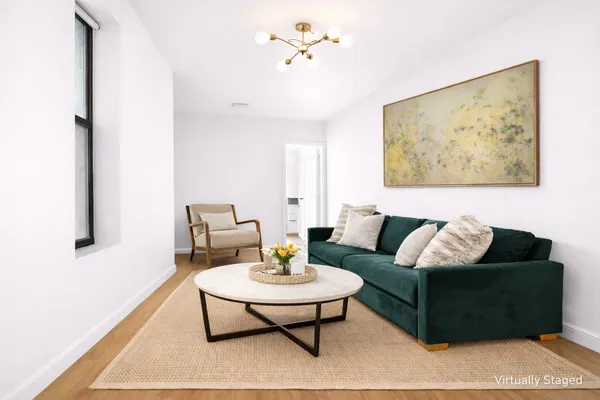 a living room with furniture and a rug
