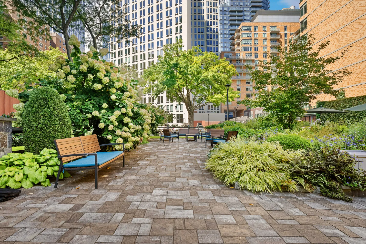 a view of a bench sitting in backside of a building