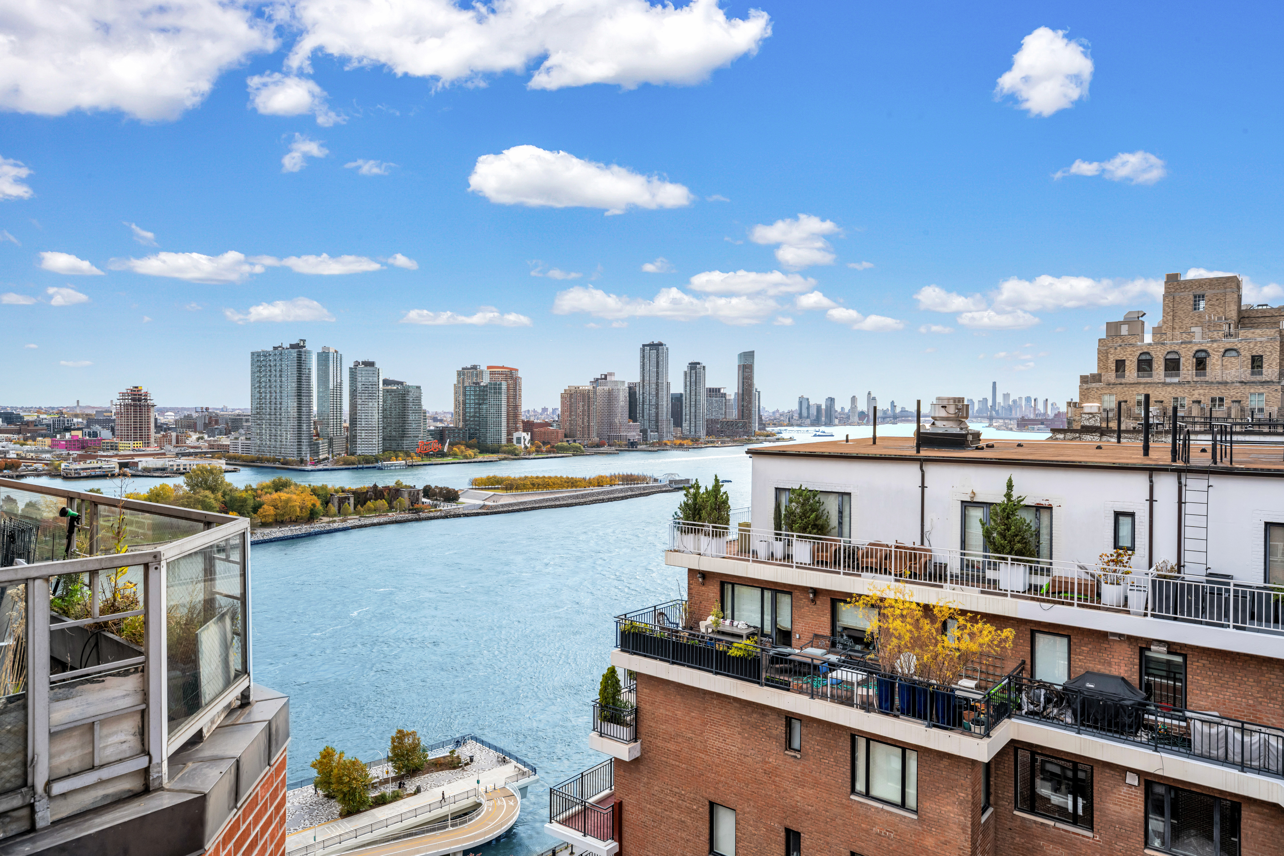 50 Sutton Place South, Unit 21L Manhattan, NY 10022 - Photo 8 of 12 a view of a city with tall buildings