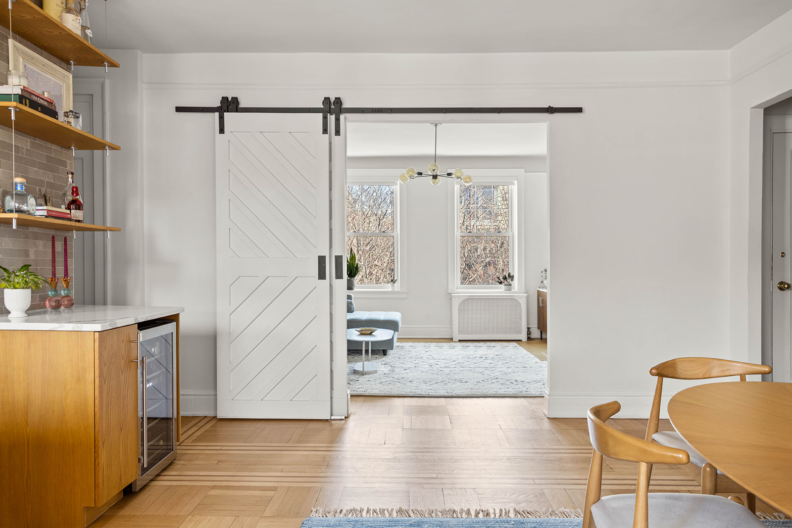 34-28 80th Street, Unit 41 Queens, NY 11372 - Photo 6 of 15 a view of a livingroom with wooden floor and furniture