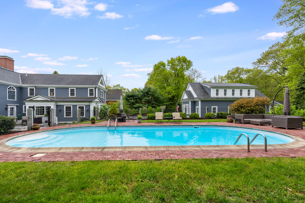 79 Pine Street Dover, MA 02030 - Photo 23 of 25 a view of a house with swimming pool and yard