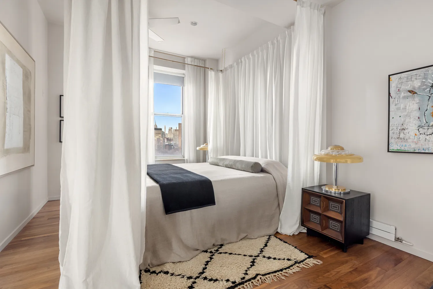 a bedroom with a bed and a table