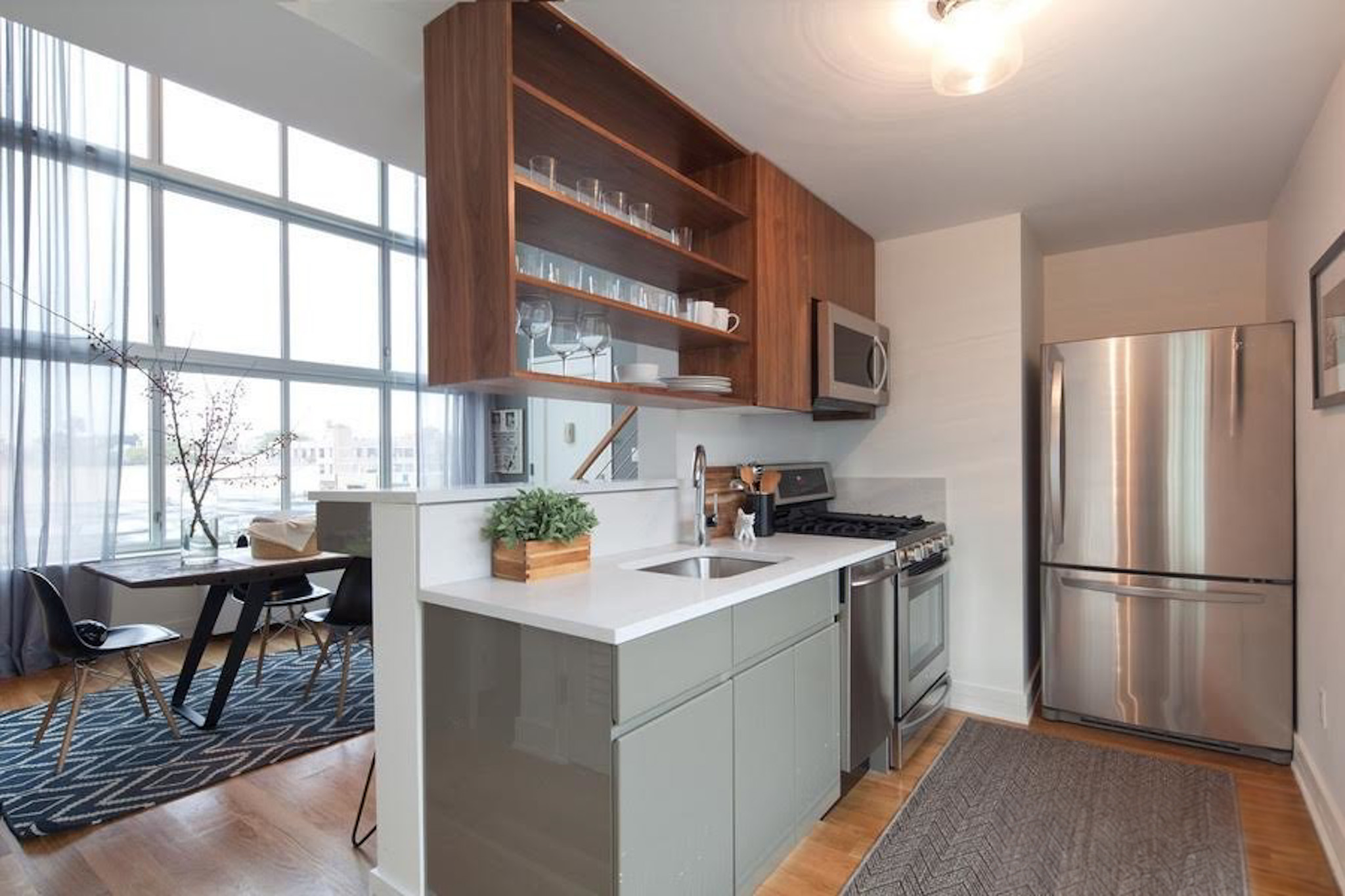 224 Wythe Avenue, Unit 68E Brooklyn, NY 11249 - Photo 4 of 10 a kitchen with a sink appliances and cabinets
