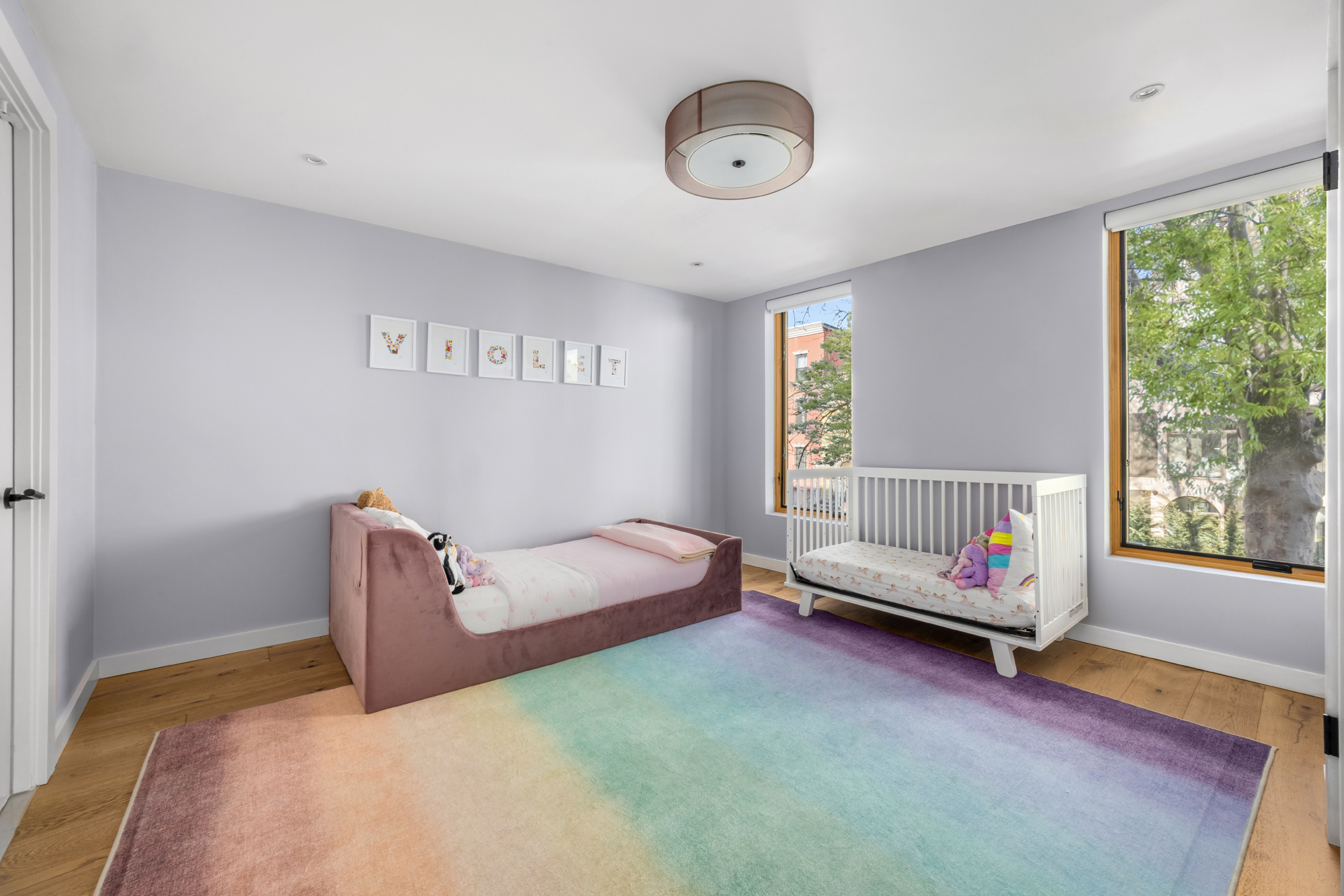 683 Leonard Street Brooklyn, NY 11222 - Photo 22 of 25 a bed room with a bed and a window