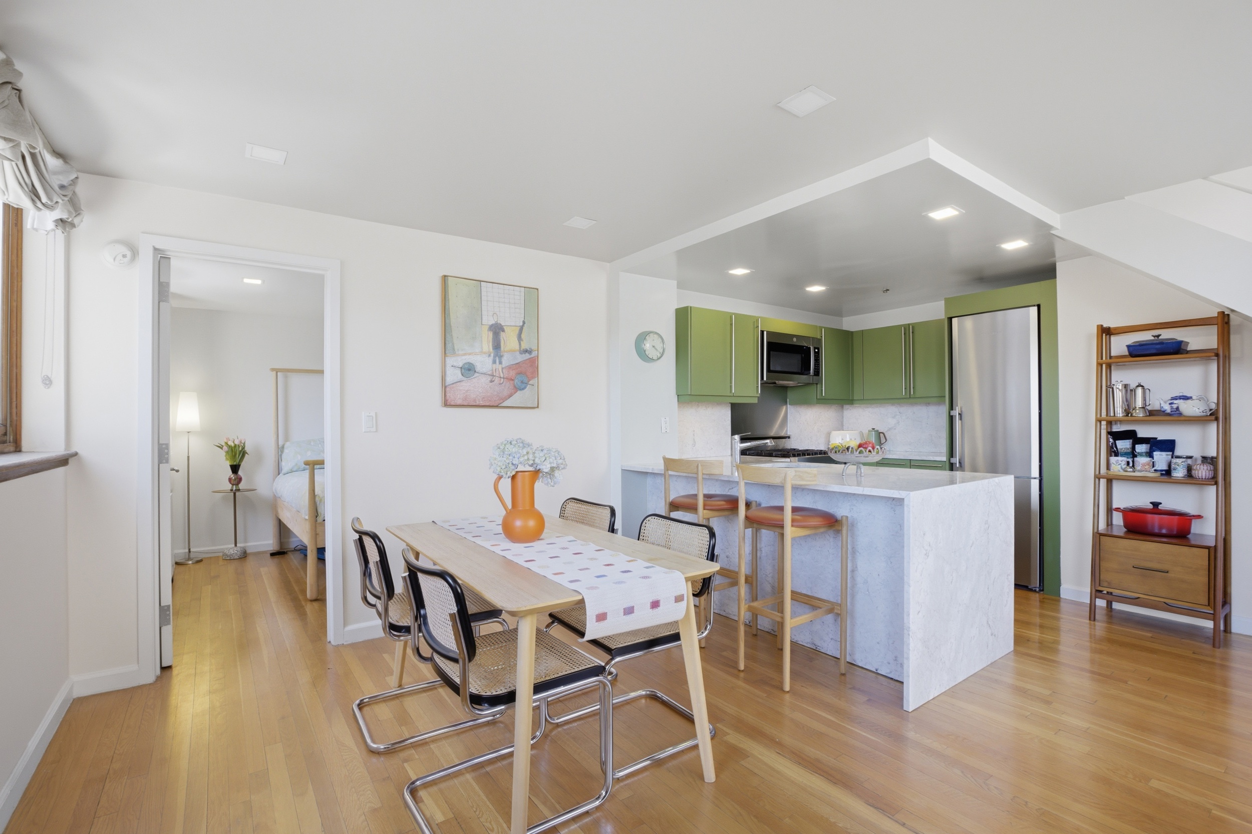 305 2nd Avenue, Unit 521 Manhattan, NY 10003 - Photo 4 of 20 a kitchen with a table and chairs in it