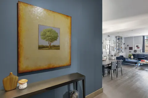 a view of workspace with wooden floor and dining room