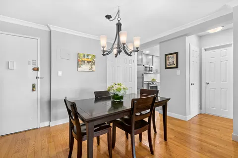 a dining room with furniture and window