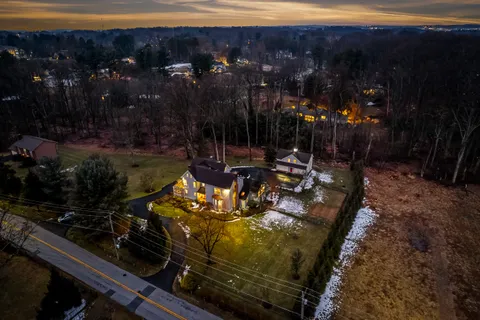 a living room with furniture fireplace and flat screen tv