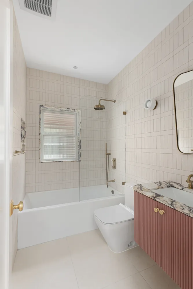 a bathroom with a bathtub and shower