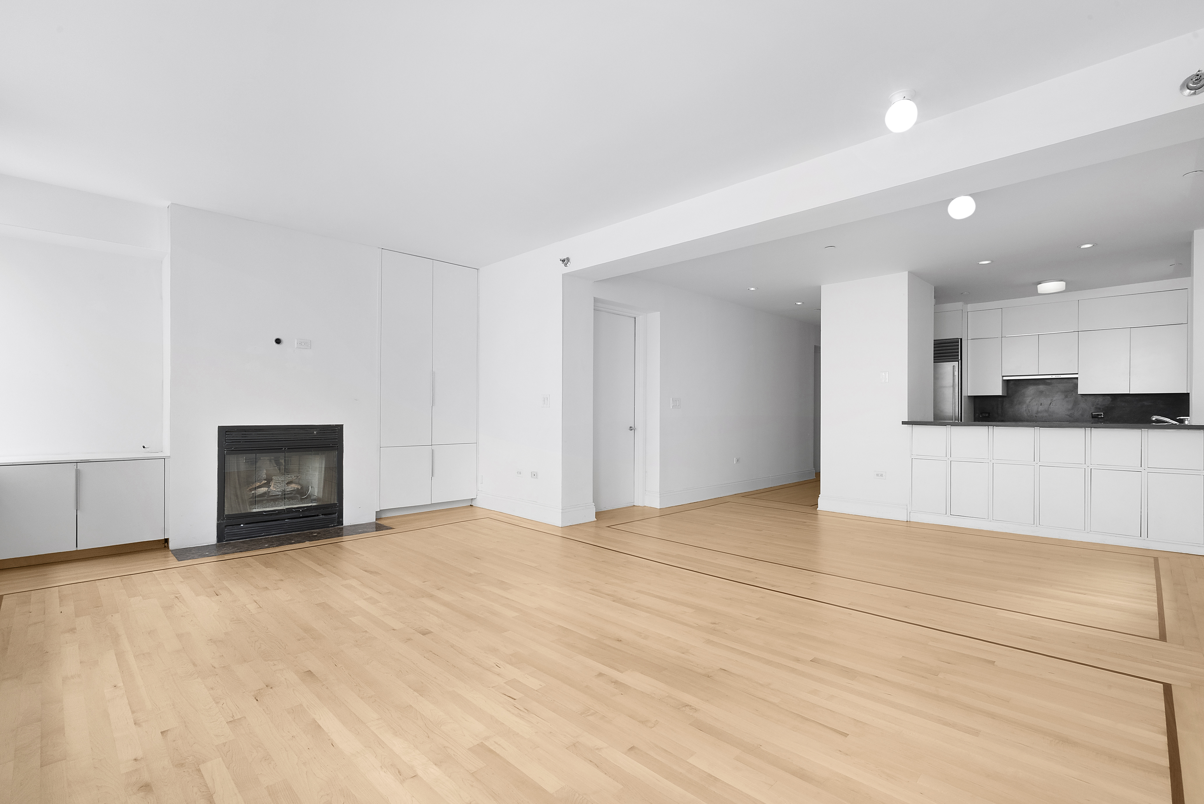 223 West 80th Street, Unit 7 Manhattan, NY 10024 - Photo 14 of 15 a view of an empty room with kitchen and a window