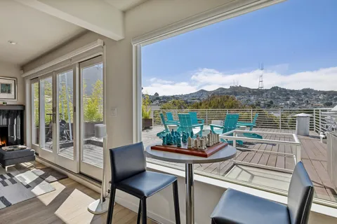 a view of a chair and table in the terrace