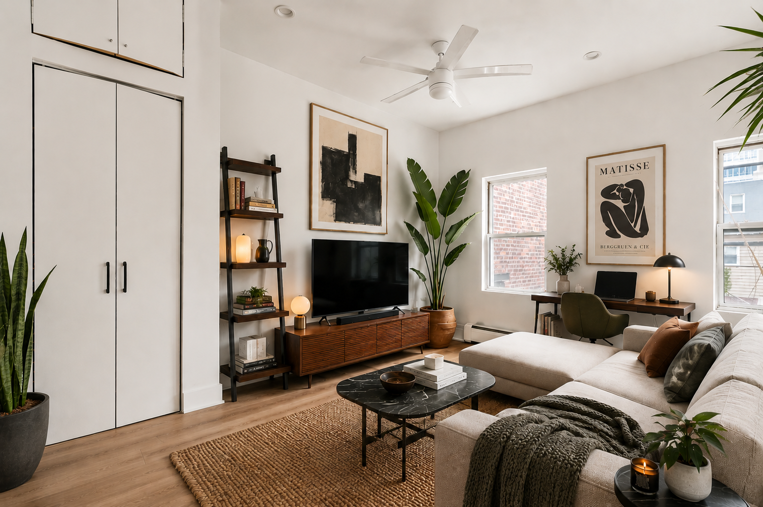 41 Frost Street, Unit 2 Brooklyn, NY 11211 - Photo 2 of 7 a living room with furniture a fireplace and a flat screen tv