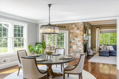 a kitchen with granite countertop a sink stove and cabinets