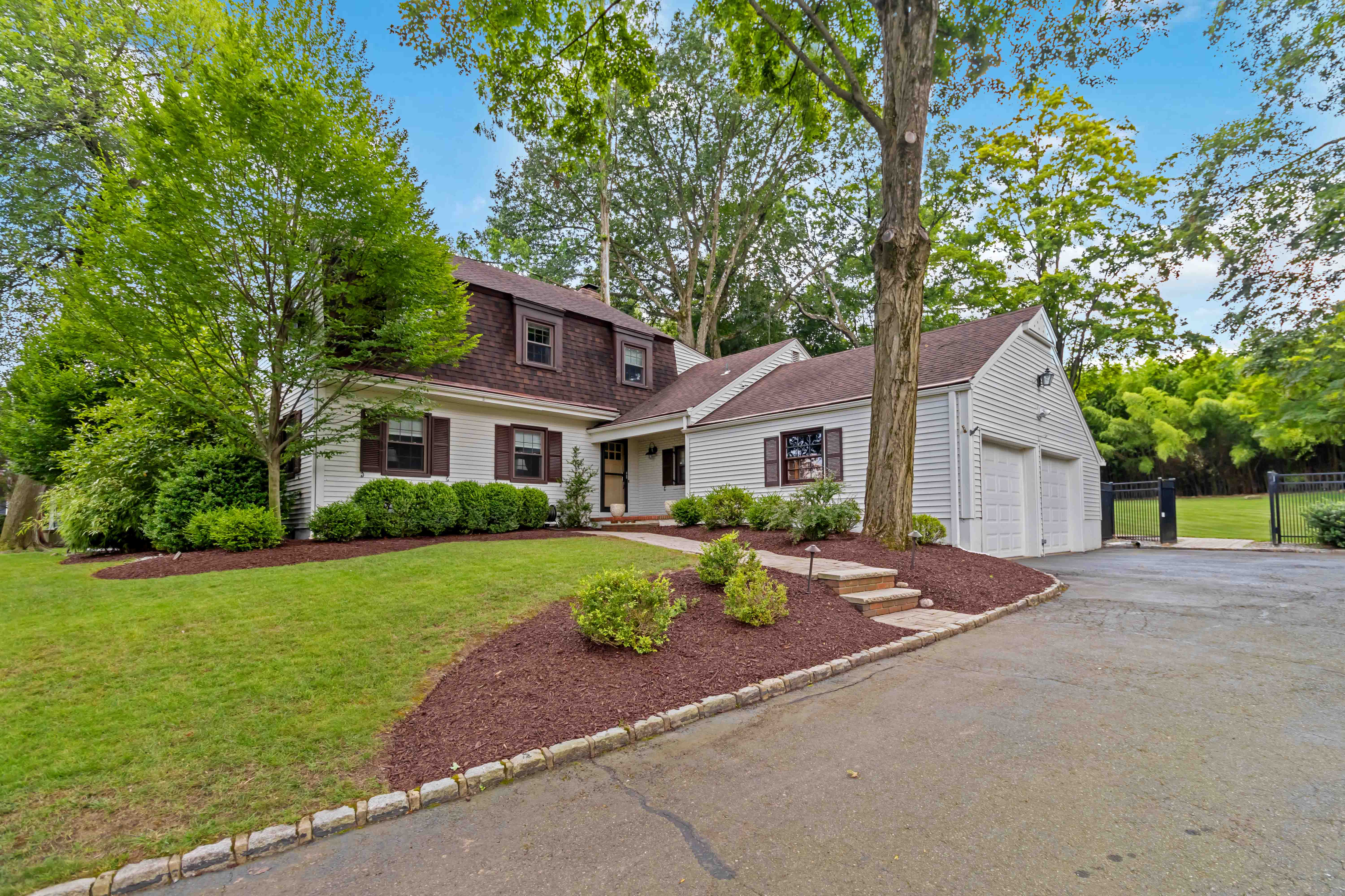 34 Colonial Drive Morristown, NJ 07960 - Photo 4 of 41 a front view of a house with a yard and porch