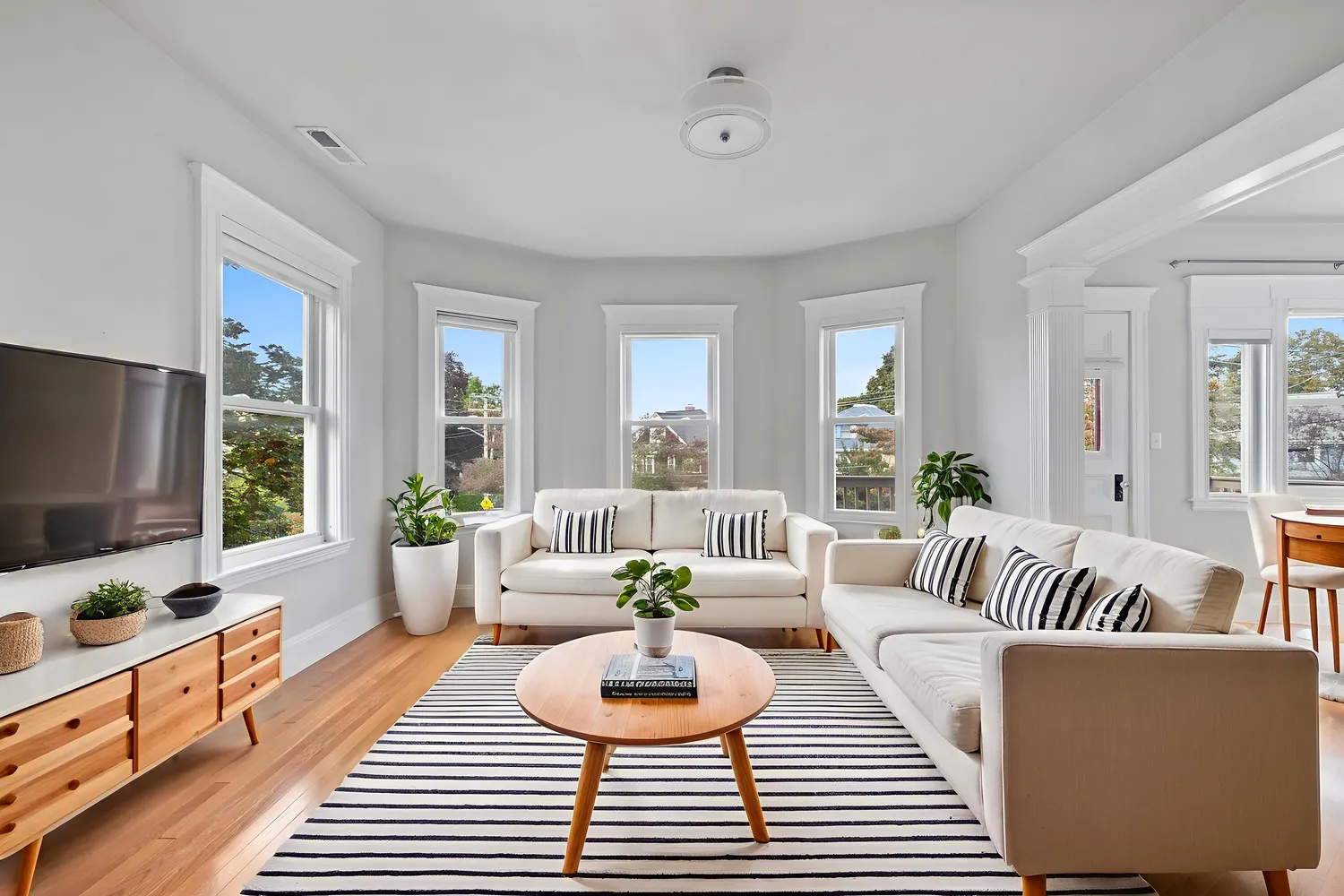 a living room with furniture and a flat screen tv