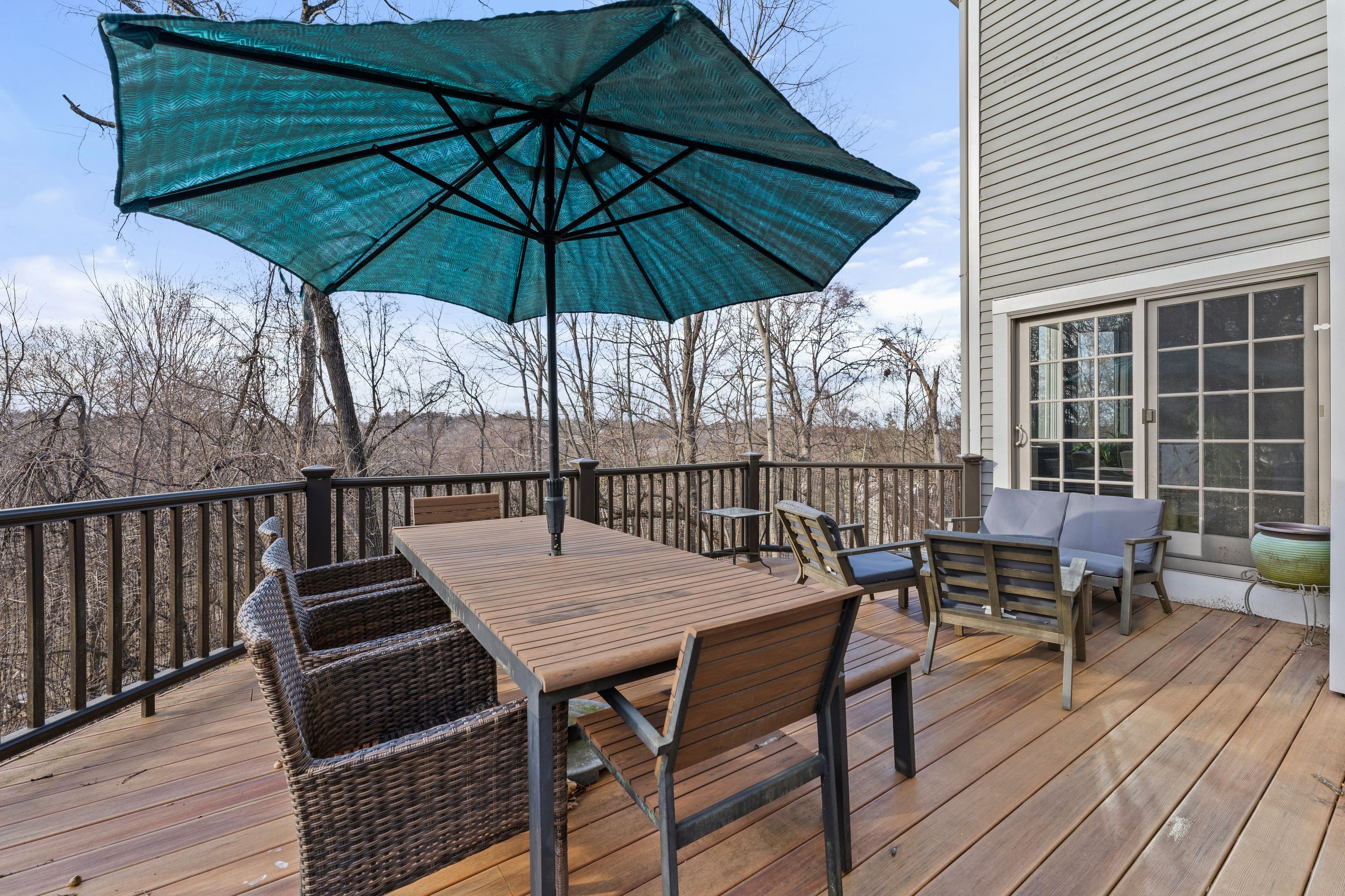 124 Boulder Ridge Road Scarsdale, NY 10583 - Photo 22 of 31 an outdoor space with wooden floor and umbrella