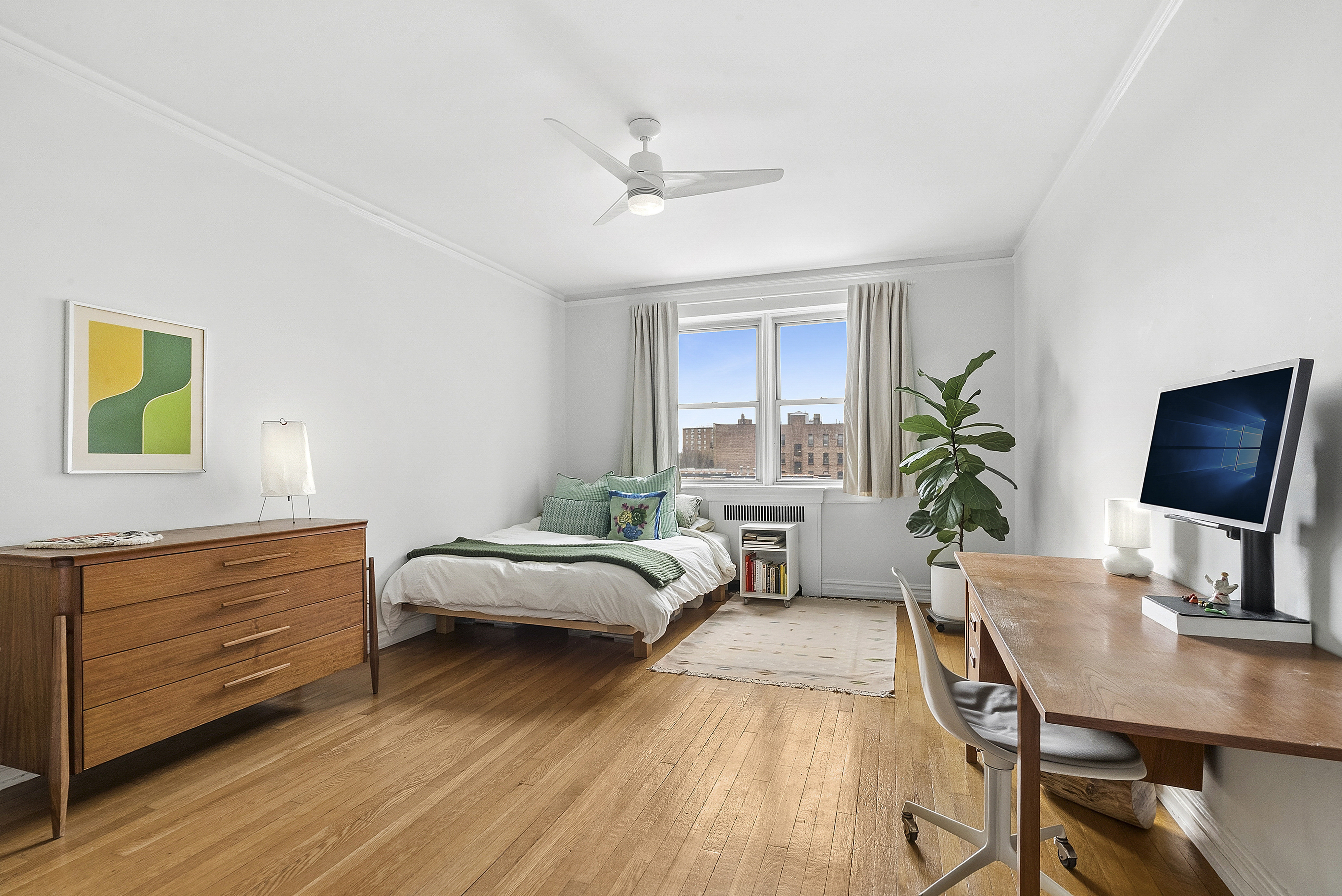 474 West 238th Street, Unit 2E Bronx, NY 10463 - Photo 7 of 13 a bedroom with a bed window and a desk