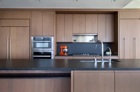 a kitchen with a sink and cabinets