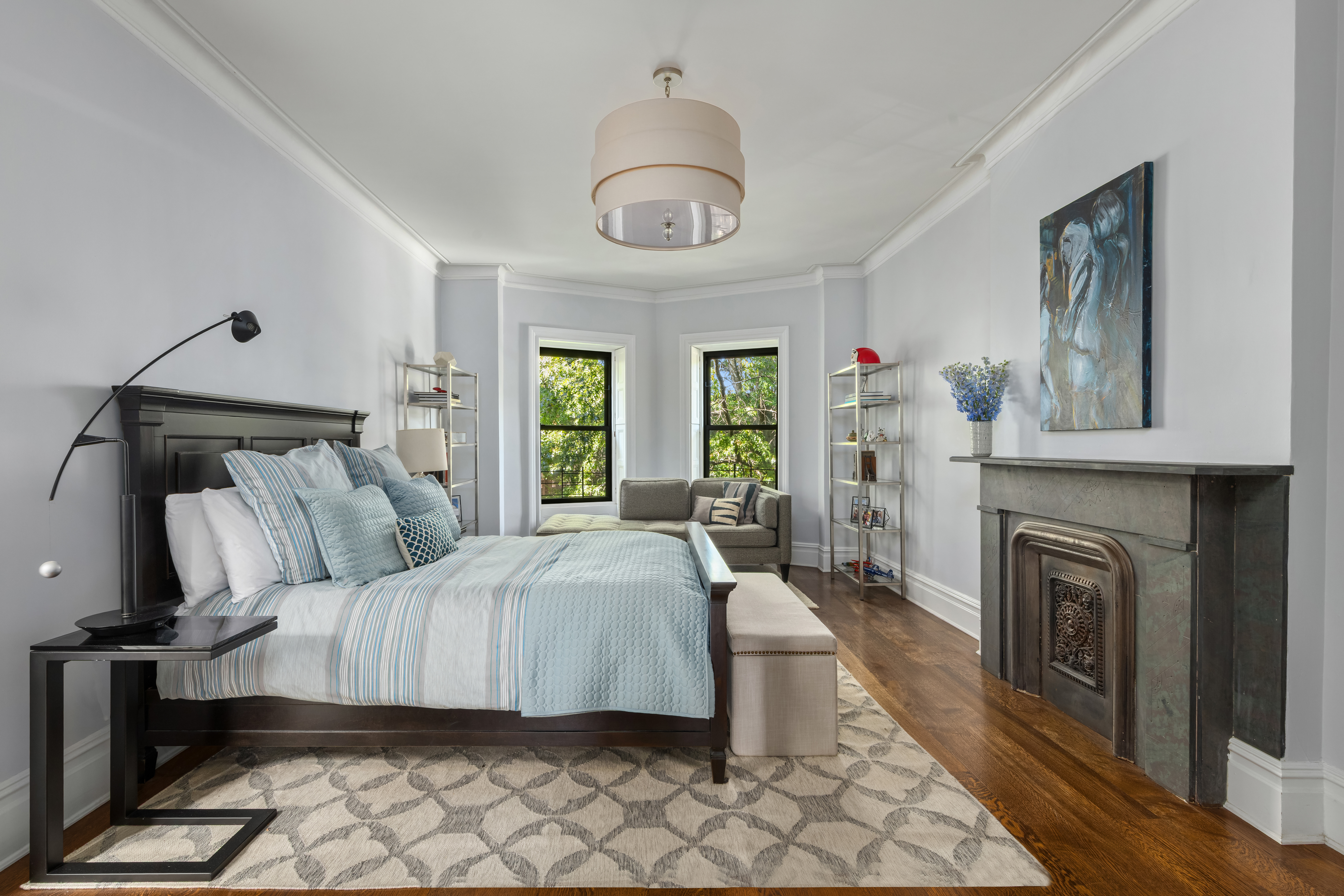 159 6th Avenue, Unit TRIPLEX Brooklyn, NY 11217 - Photo 8 of 19 a bedroom with a bed and a fireplace