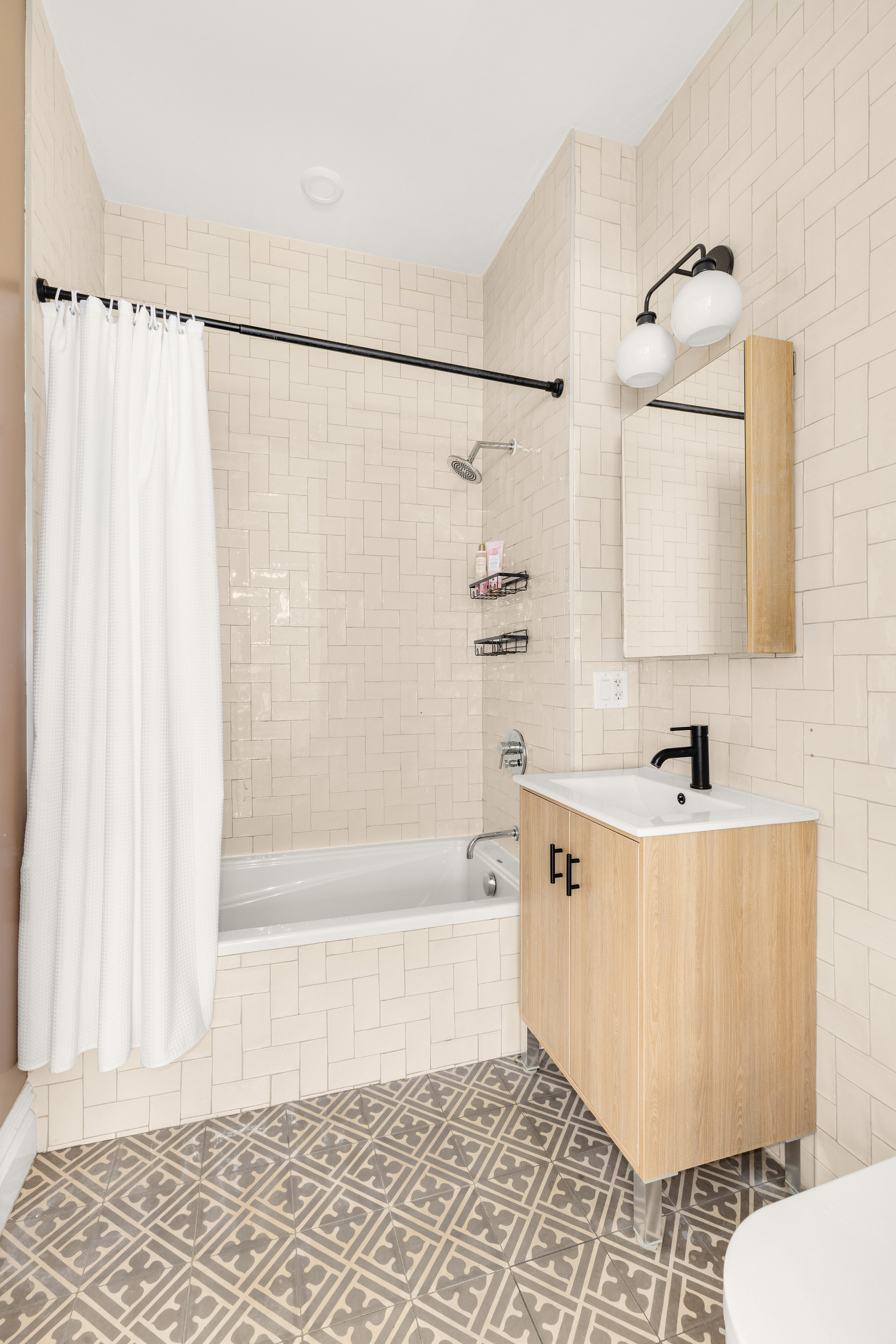 729 Decatur Street, Unit 1 Brooklyn, NY 11233 - Photo 6 of 7 a bathroom with a bathtub and a shower