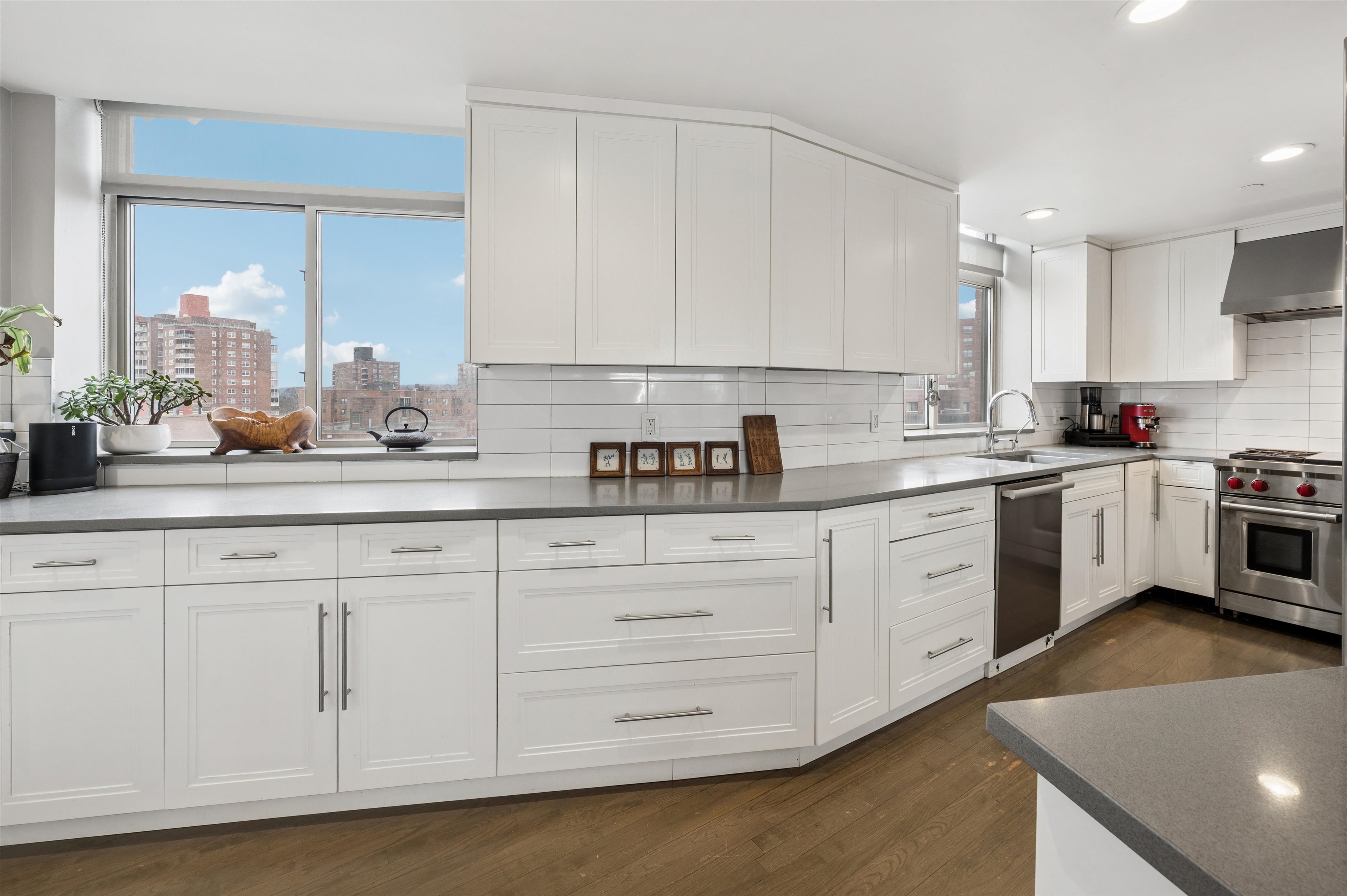3625 Oxford Avenue, Unit 7C Bronx, NY 10463 - Photo 5 of 20 a kitchen with white cabinets and white appliances