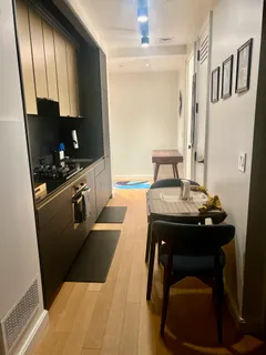 a kitchen with sink cabinets and stove