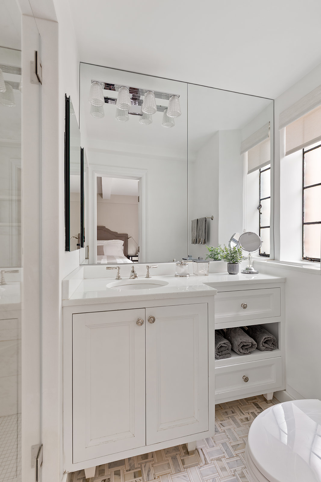 71 East 77th Street, Unit 8A Manhattan, NY 10075 - Photo 5 of 9 a bathroom with a sink double vanity and a mirror